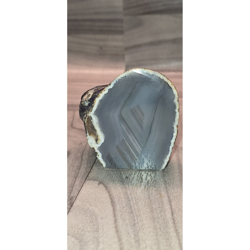 agate mineral specimen with visible concentric banding and a crystalline center